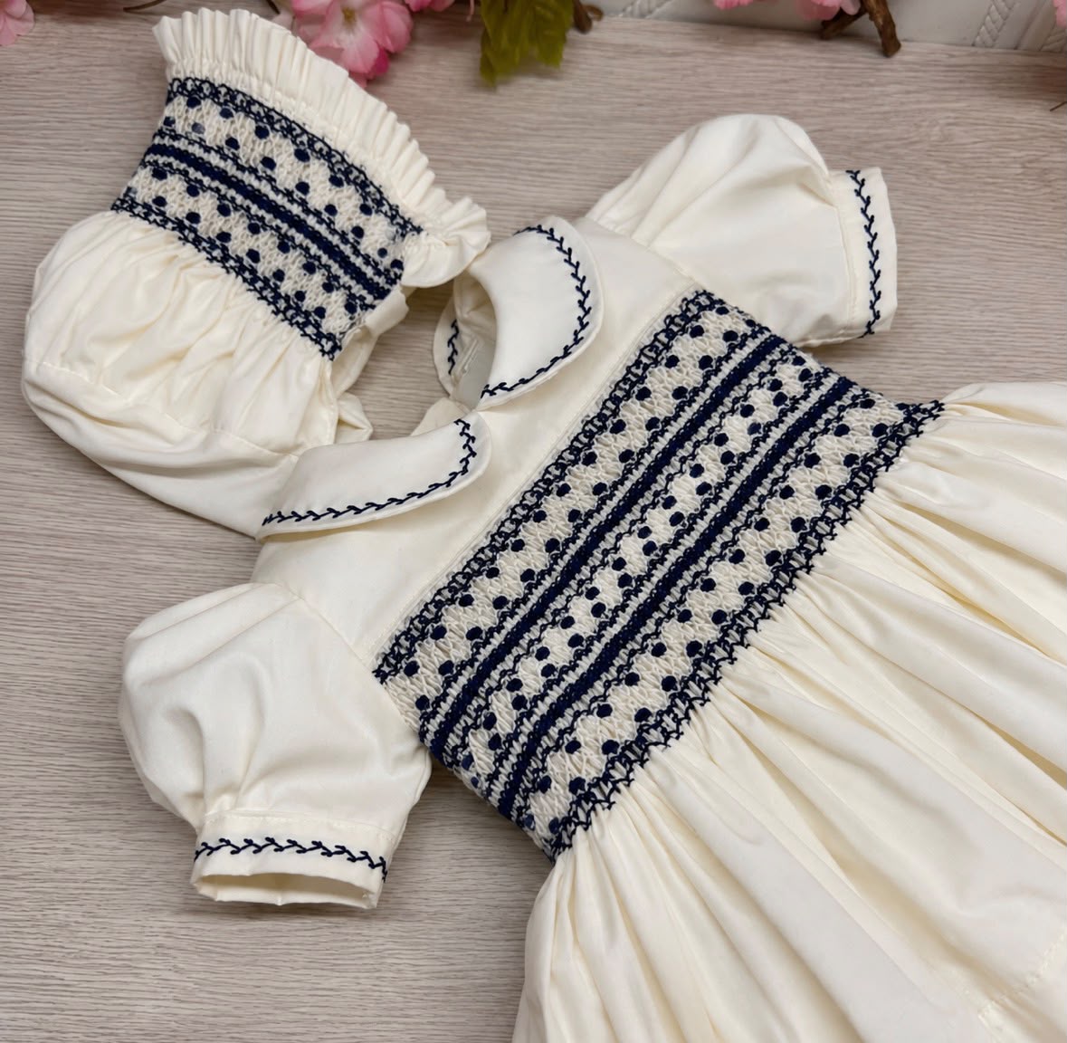 Ivory and navy smock dress.